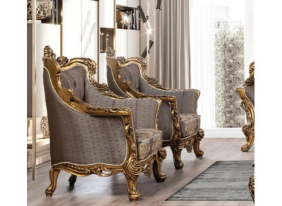 Ein luxuriöser klassischer Ohrensessel in Dunkelgrau mit goldenem Barockdesign von Chesterfield