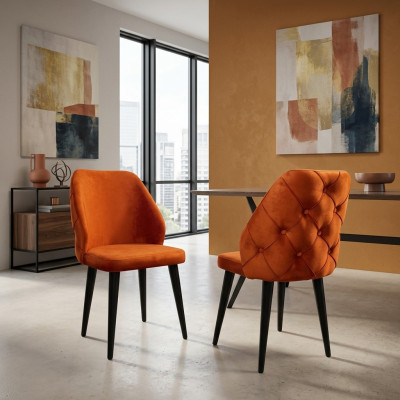Gepolsterter Holzstuhl orange Chesterfield auf schwarzen Beinen das Esszimmer